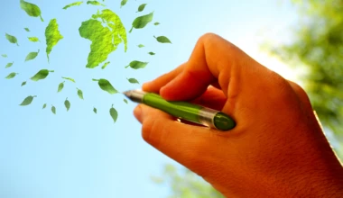 Stockvault hand sketching green globe in the sky175280